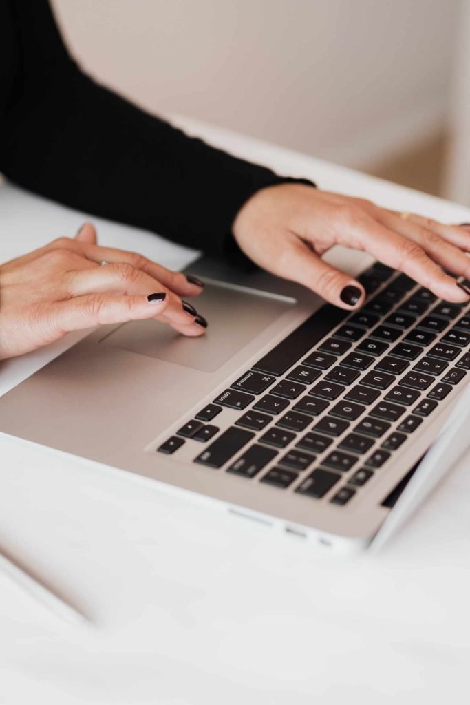 Woman typing on laptop