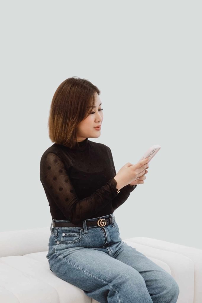 Woman scrolling phone